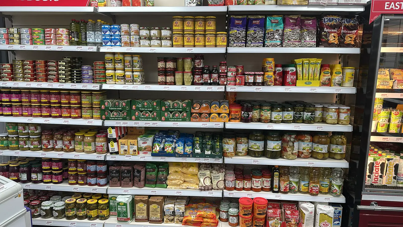 Eastern European shelves at World of Spices: pickles, gherkins, mayonnaise, ketchup, sprats, sunflower seeds, buckwheat and semolina