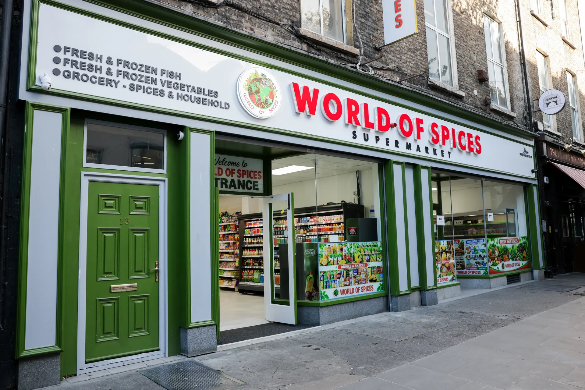 The World of Spices supermarket shopfront on Talbot Street, with its red sign and green door