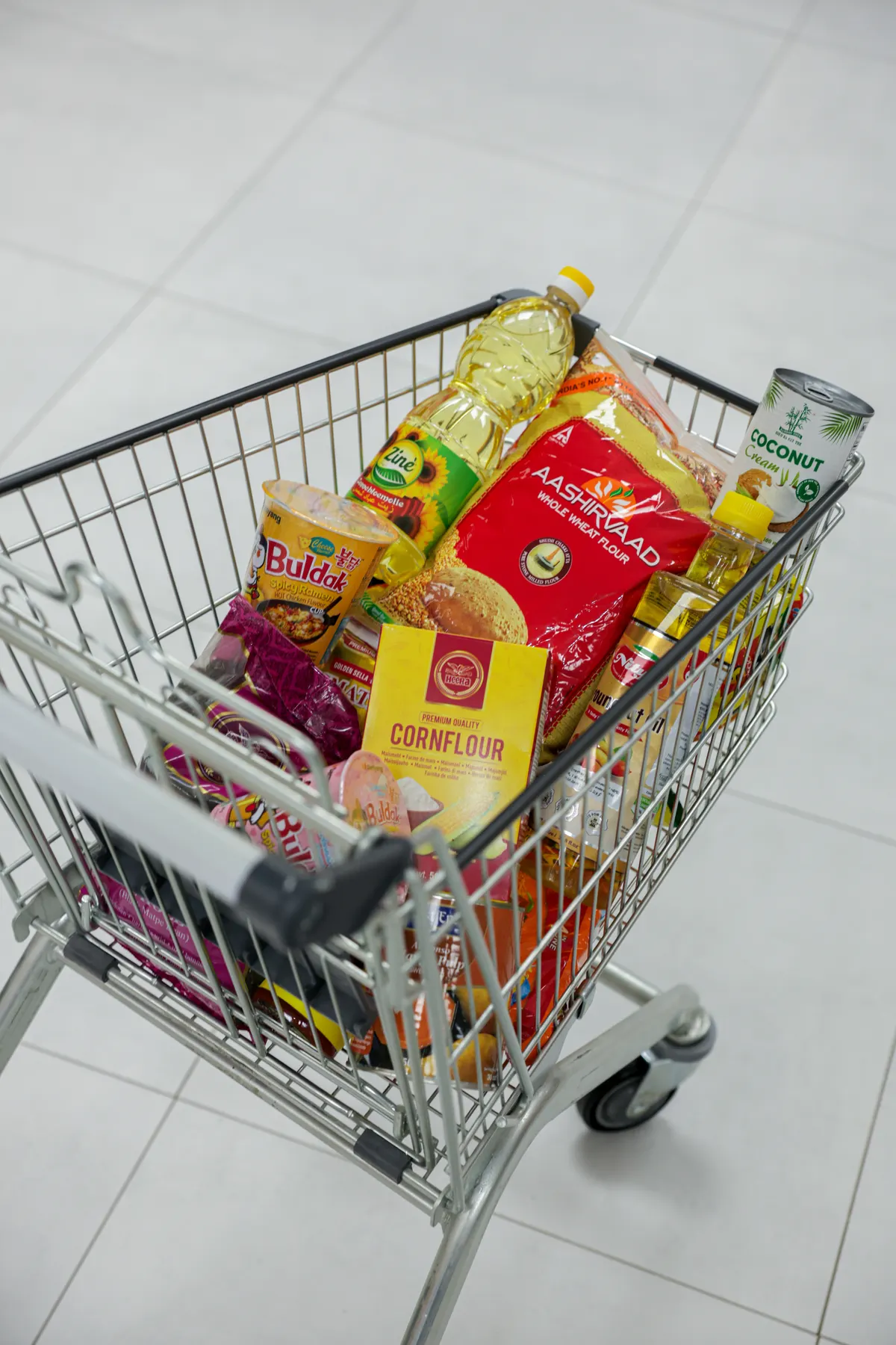 A trolley loaded with rice, flour, oil and spices at World of Spices